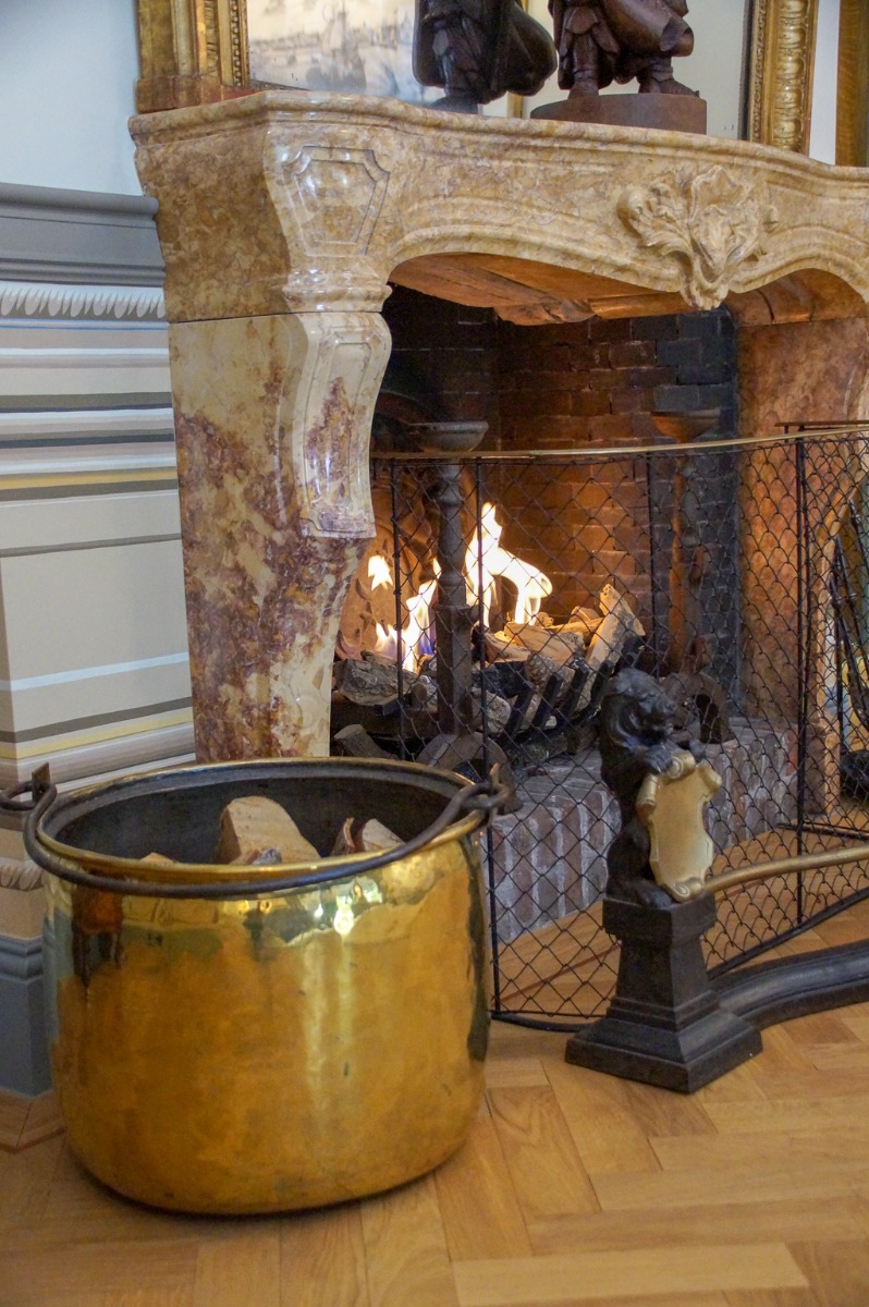 Burning fireplace with fireplace accessories