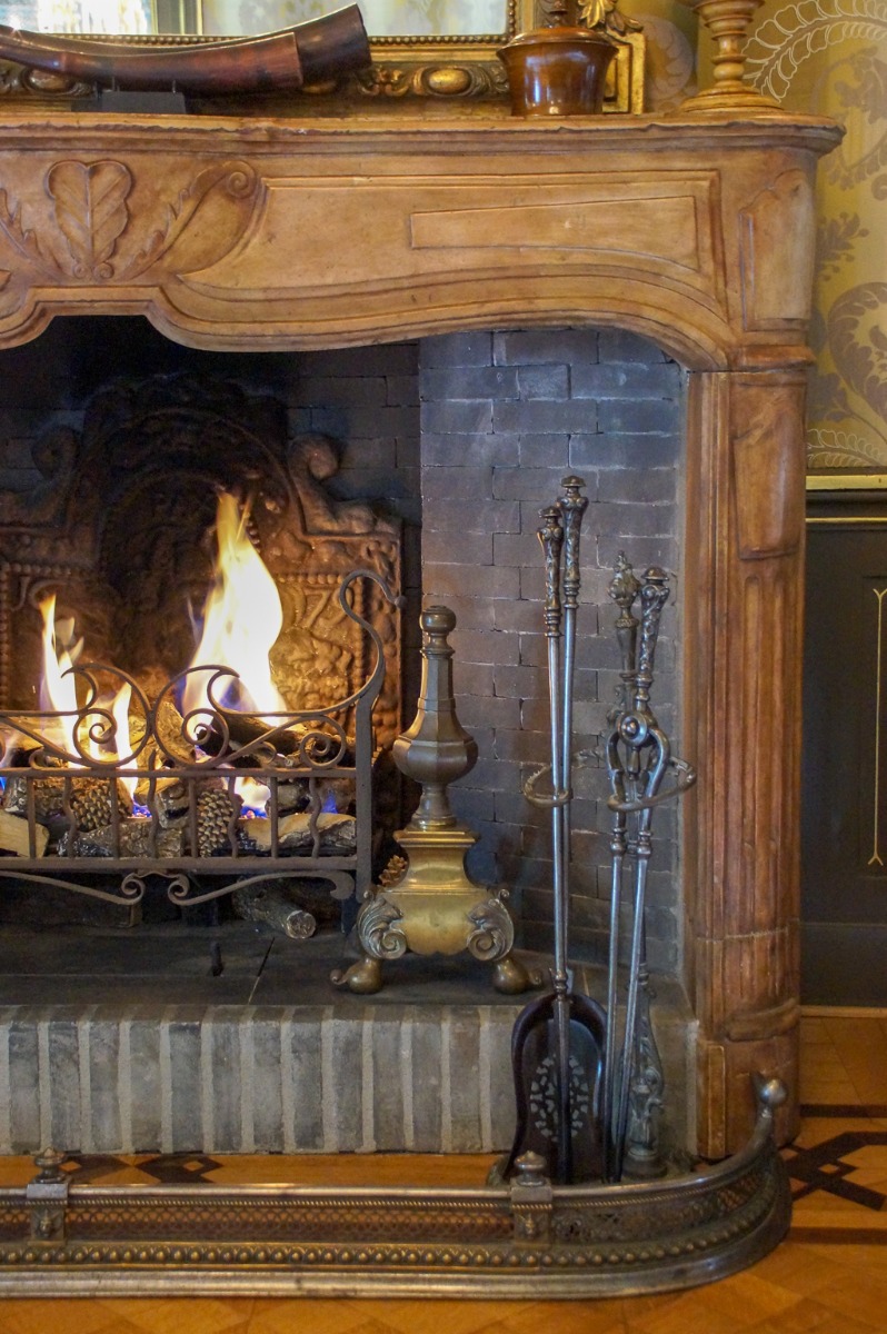 Gas fireplace decorated as wood-burning fireplace