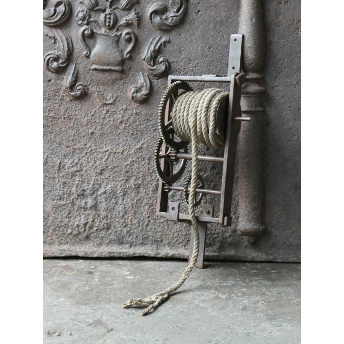Antique Wall-Mounted Spit Jack made of Wrought iron, Brass, Wood, Rope 