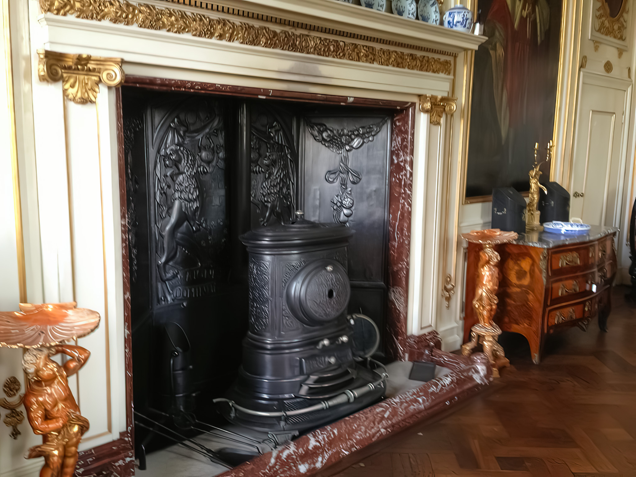 Large heat shield behind an antique stove