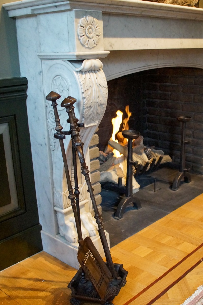 Antique fireplace with fireplace accessories