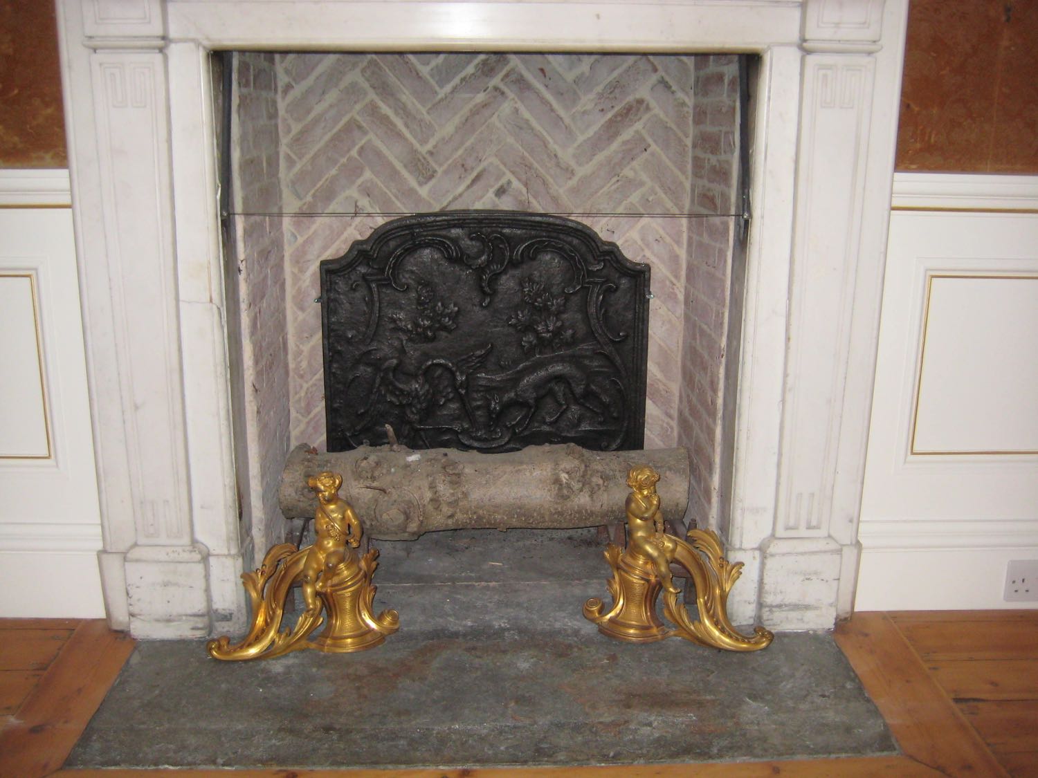 Fireback in fireplace in Wiltshire, UK sourced from https://www.firebacks.net