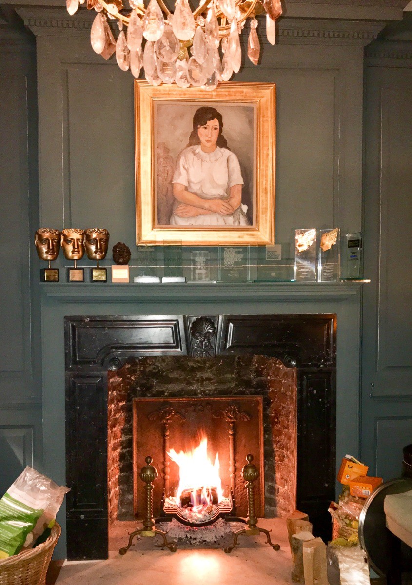 Fireback in beautiful fireplace London, UK sourced from https://www.firebacks.net