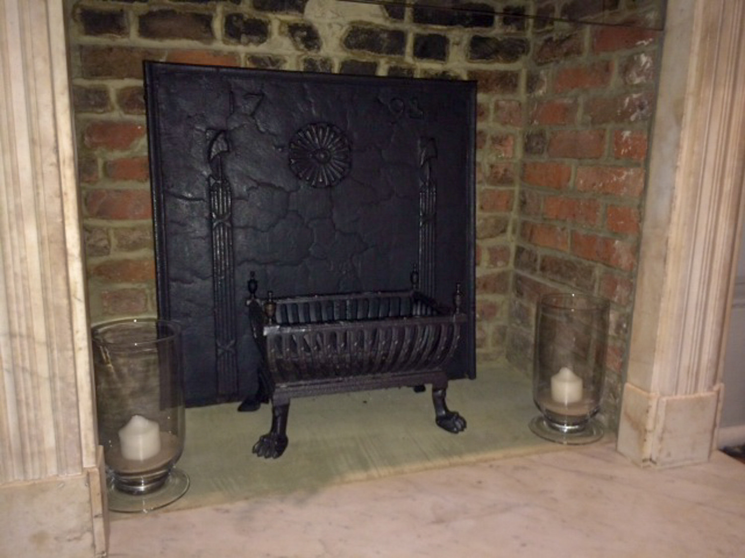 Fireplace fireback and fire grate in London from https://www.firebacks.net