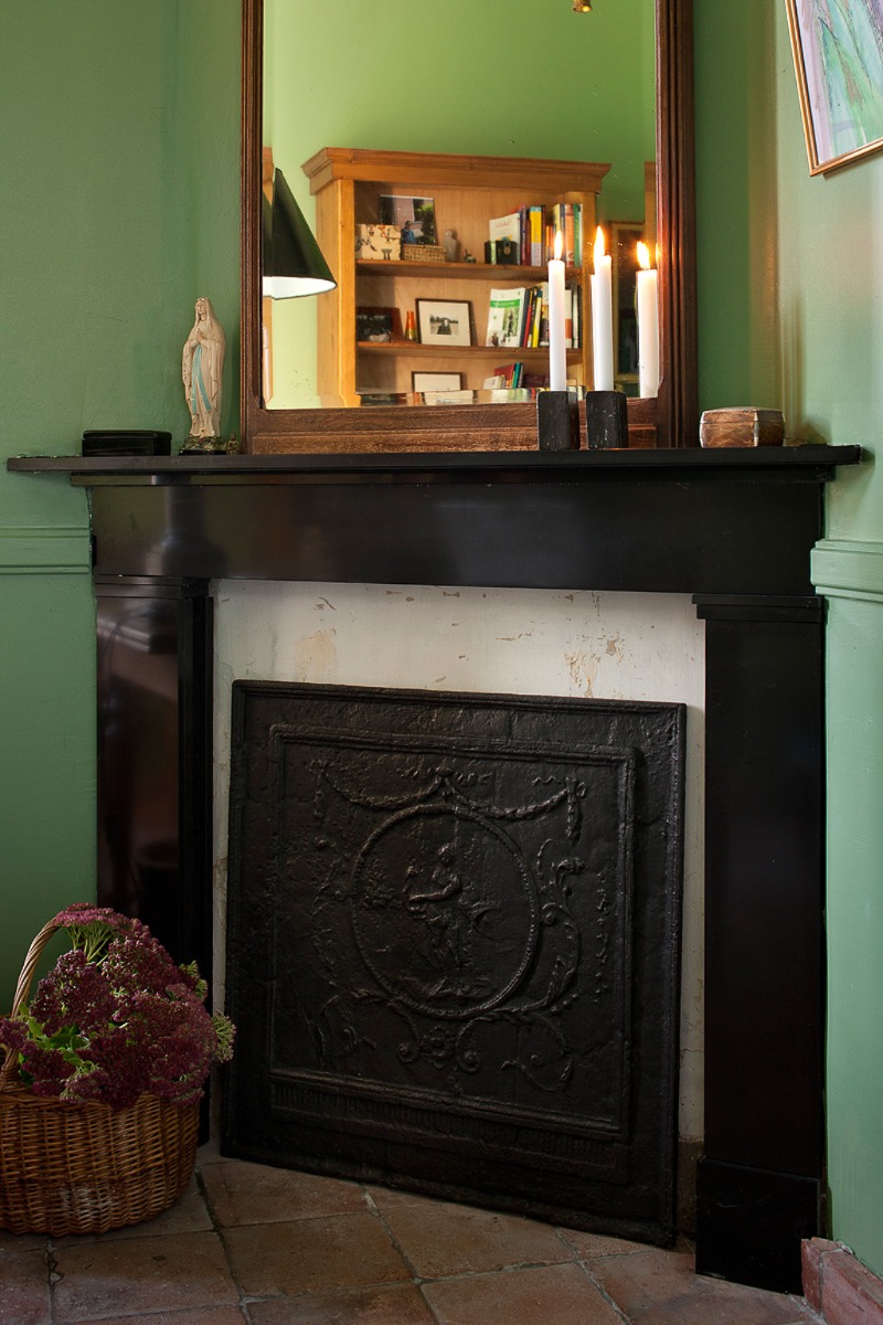 Unused fireplace decorated as a wood-burning fireplace