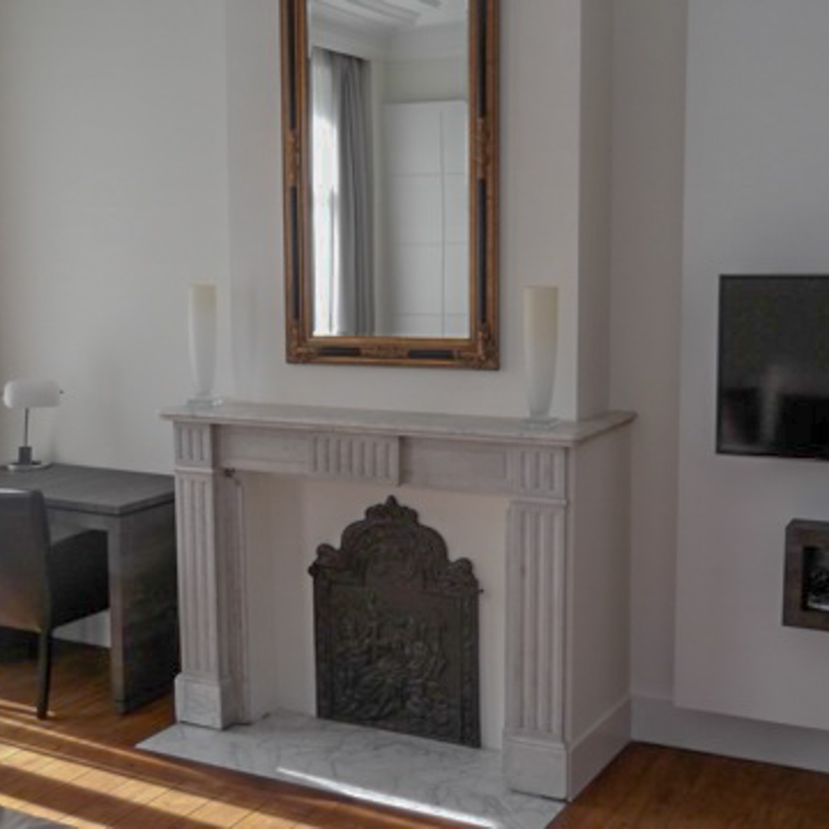 Unused fireplace decorated as a wood-burning fireplace