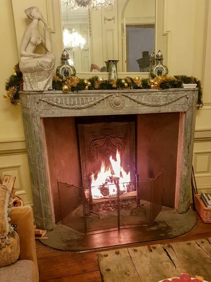 Antique French fireplace screen in antique fireplace with antique fireback, antique andirons and new fireplace grate