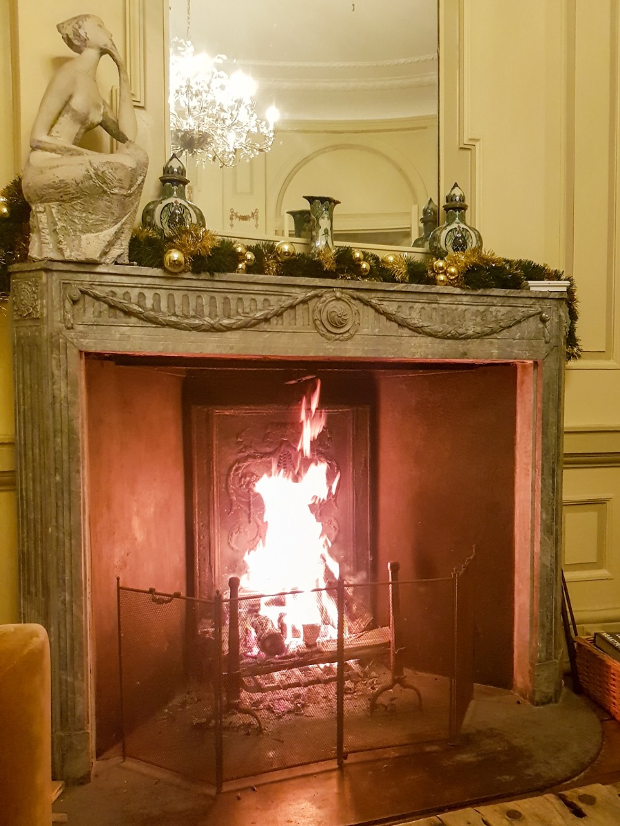 Antique French fireplace screen in an antique fireplace