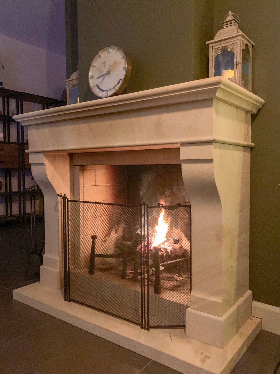 New, handmade French 3-panel fire screen (57 cm high) in a modern French fireplace with antique fireback and antique French andirons