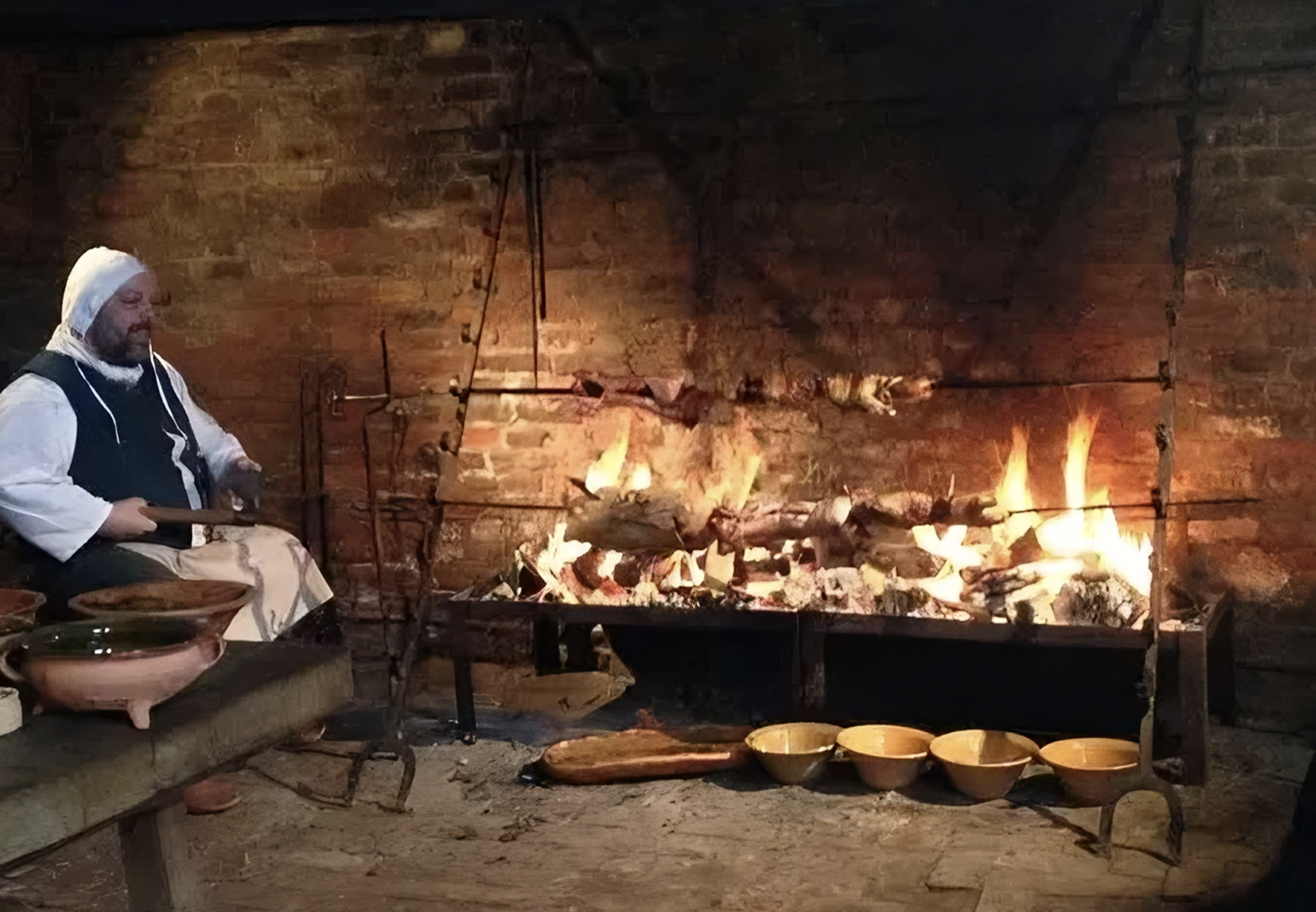 Grilling in a castle fireplace with manual turnspits