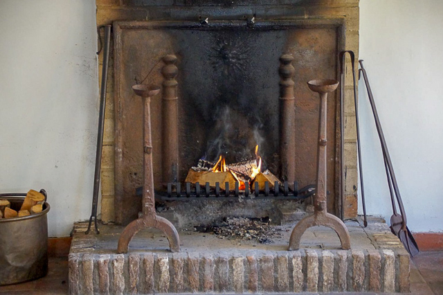 Burning fireplace with fireplace accessories