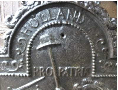 The Liberty Cap of the Pro Patria Fireplace Plate