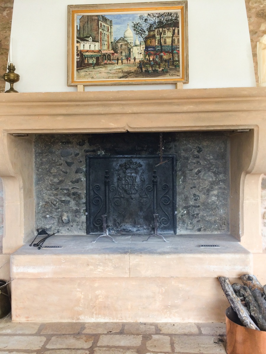 Fireback in fireplace in the Provence, France sourced from https://www.firebacks.net